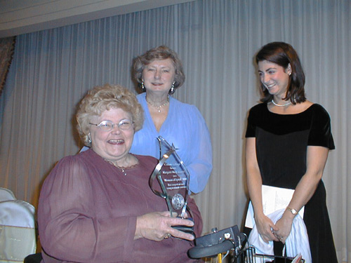photo of Professor Margaret Kimmel holding the award