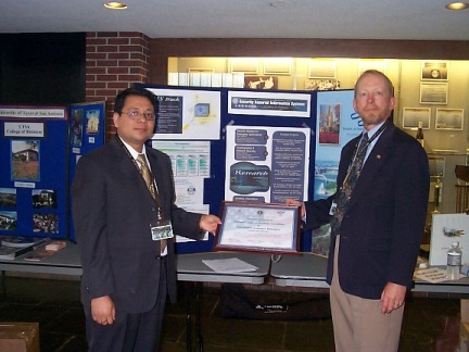 Dean Larsen and Prof. Joshi Accept NSA CAE/IAE Certification