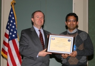 Prof. Krishnamurthy Attends CNSS Conference; Accepts CNSS Certificates